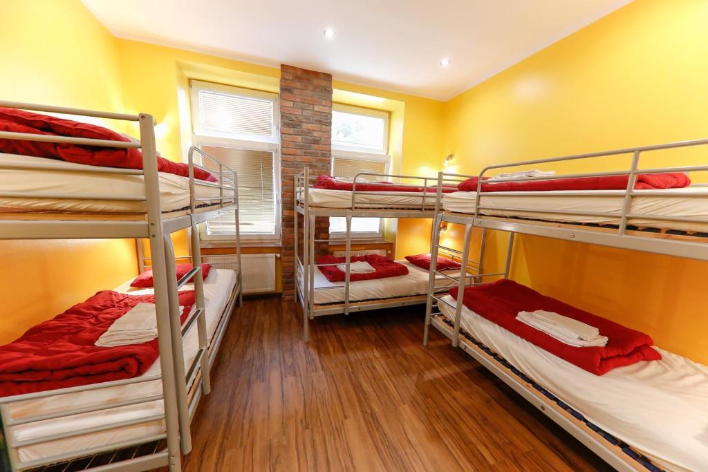 A bed or beds in a room at Do Step Inn Home - Hotel & Hostel