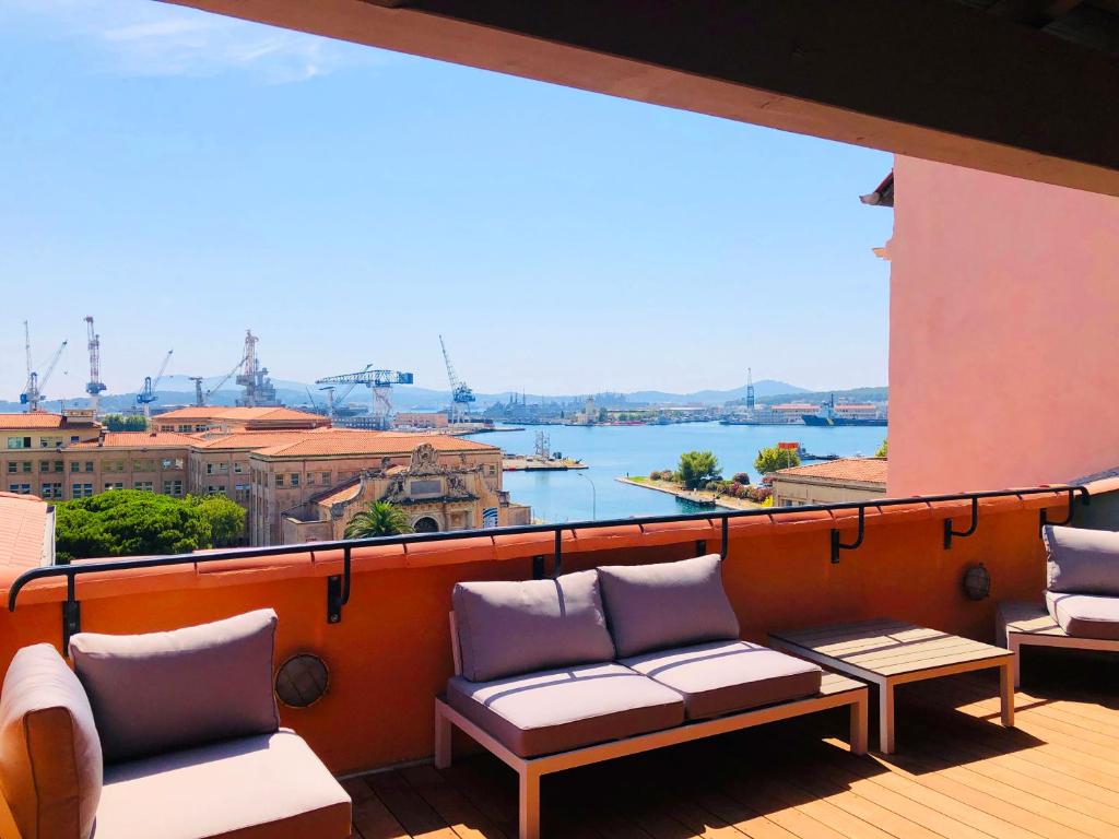 a balcony with chairs and a view of the water at L'Eautel Toulon Centre Port in Toulon