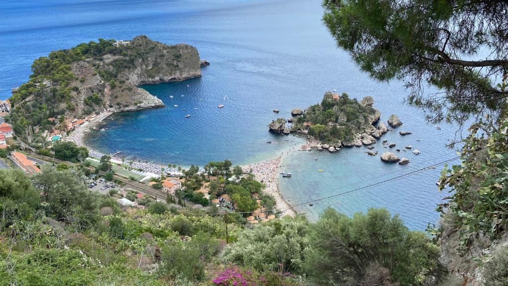 a view of a small island in the water at Villa Don Mimì Guarnaschelli la dependace in Taormina