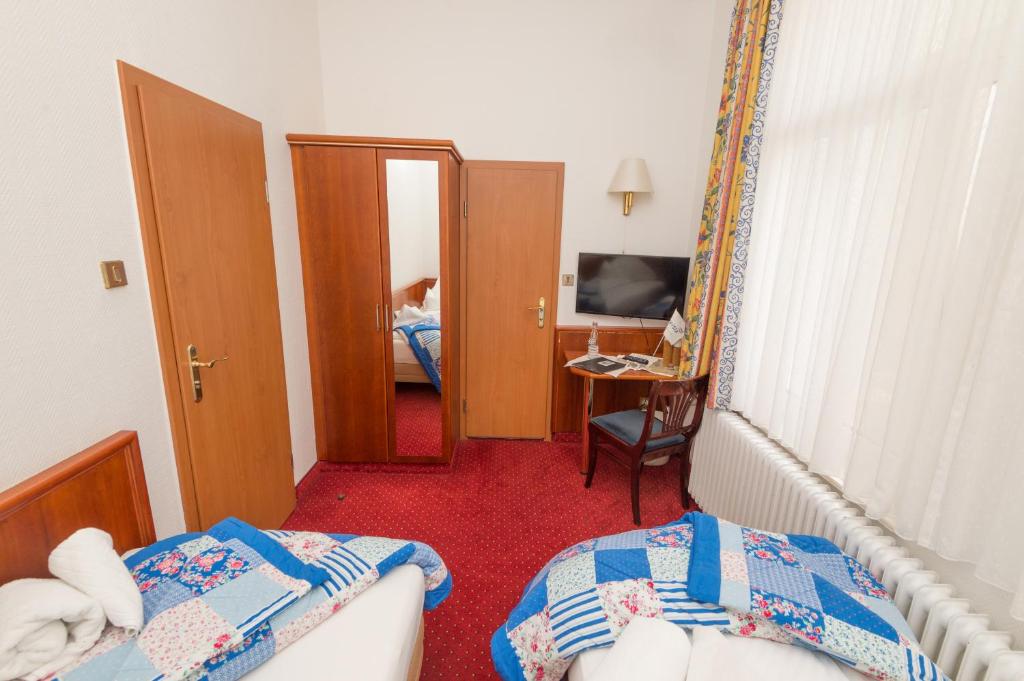 Postel nebo postele na pokoji v ubytování Inselhotel Ihnken
