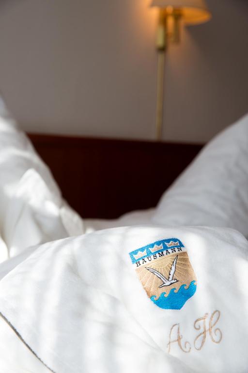 Postel nebo postele na pokoji v ubytování Inselhotel Ihnken