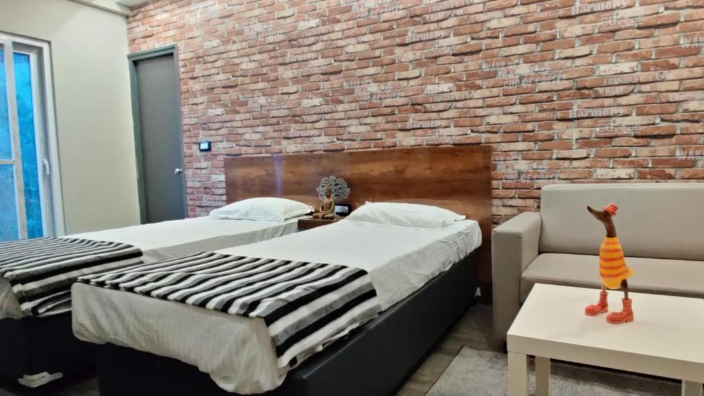 Postel nebo postele na pokoji v ubytování RESTEL STUDIO FLATS