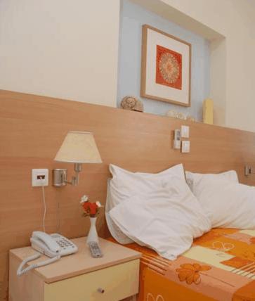 Voodi või voodid majutusasutuse Aggelos Hotel toas
