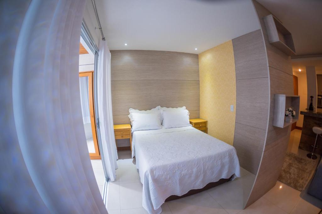 A bed or beds in a room at Studio Areia Preta