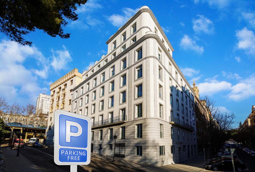 a white building with a parking sign in front of it at Plaza de España Skyline in Madrid