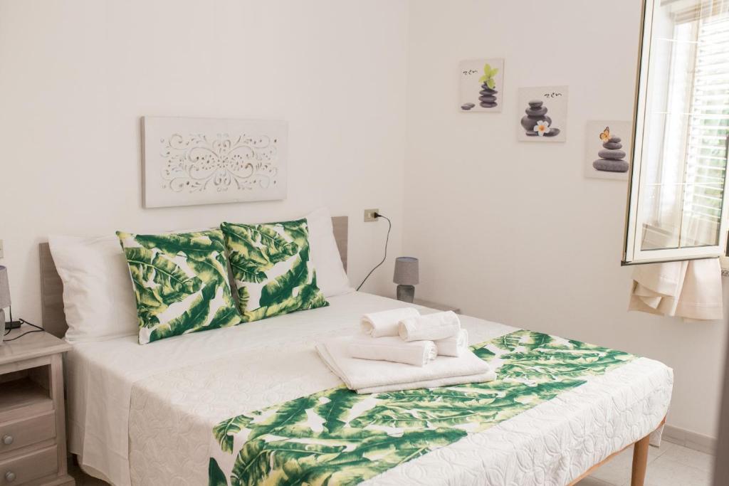 Postel nebo postele na pokoji v ubytování B&B La Quercia Budoni, Tanaunella