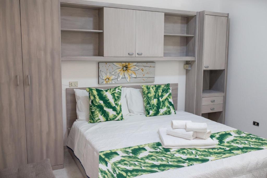 Postel nebo postele na pokoji v ubytování B&B La Quercia Budoni, Tanaunella