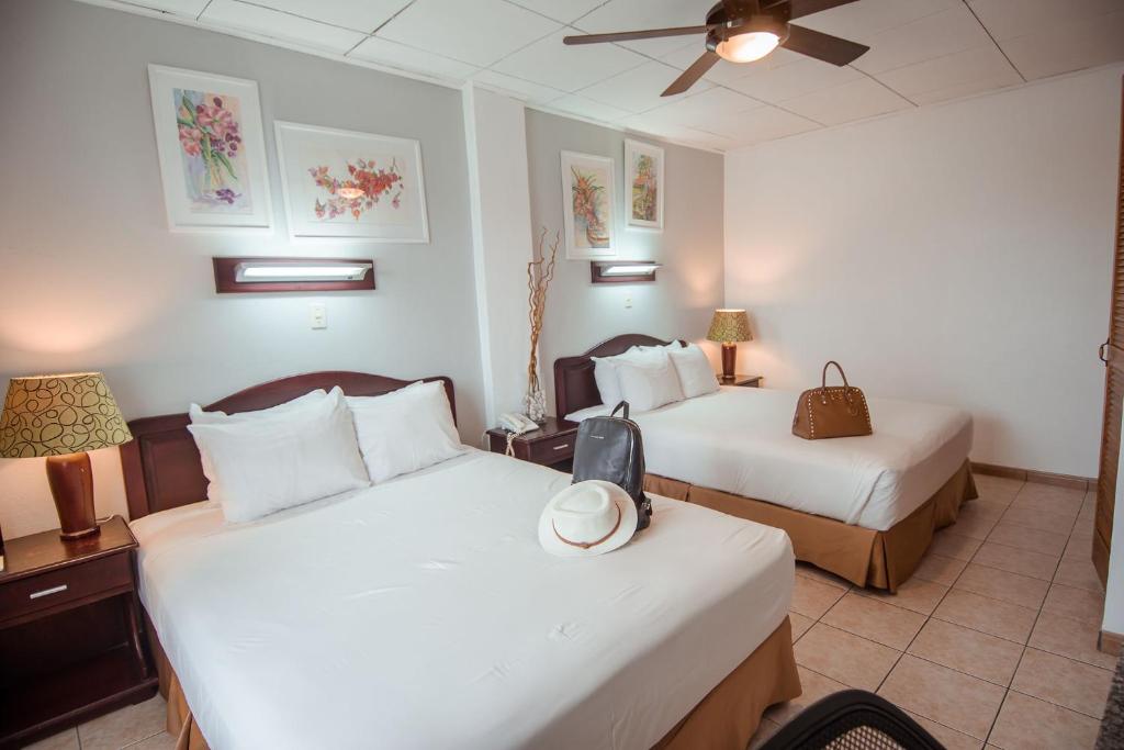 Postel nebo postele na pokoji v ubytování La Sabana Hotel Suites Apartments