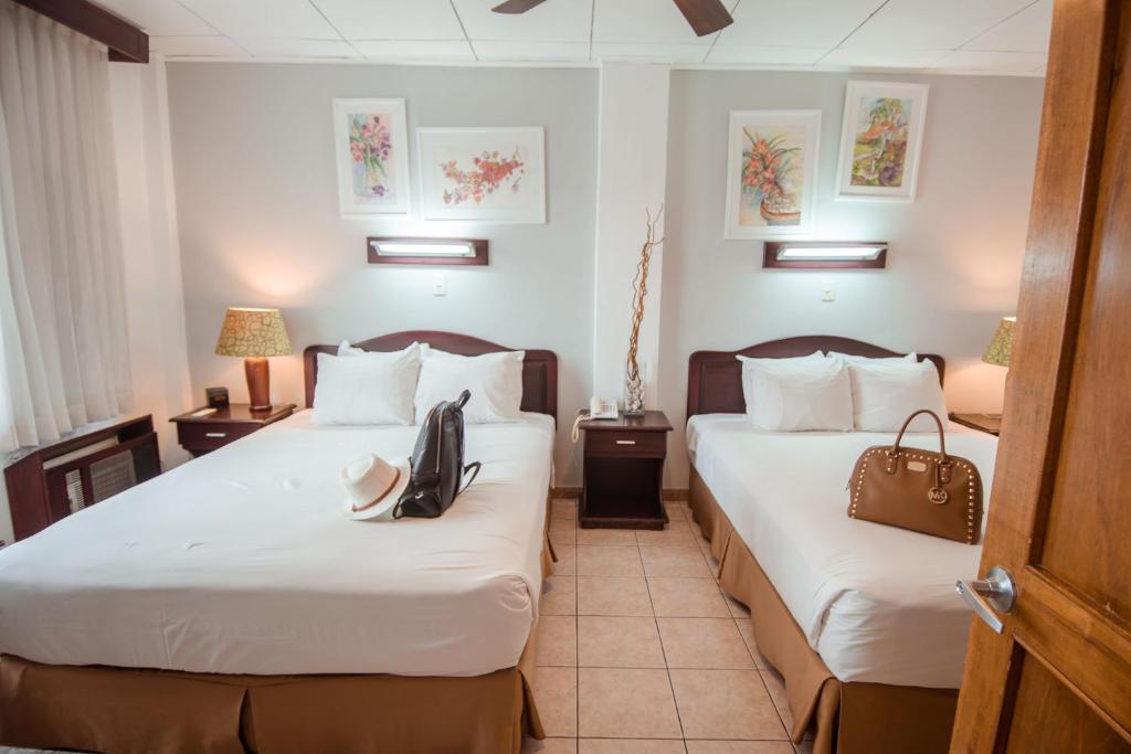 Postel nebo postele na pokoji v ubytování La Sabana Hotel Suites Apartments