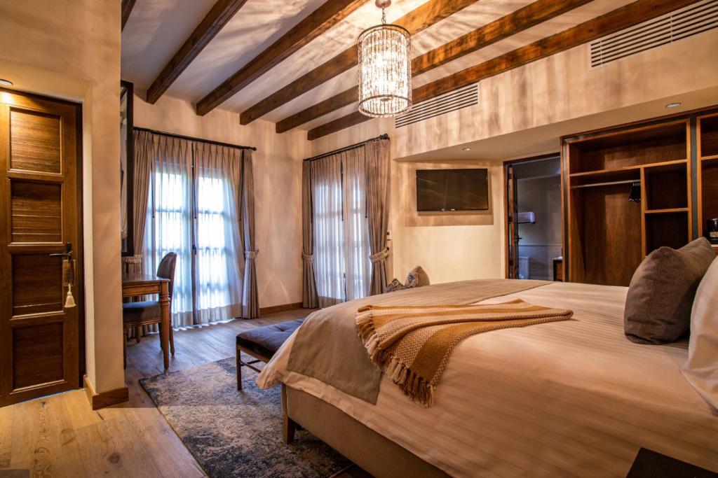 Postel nebo postele na pokoji v ubytování Hotel Apapacho Boutique
