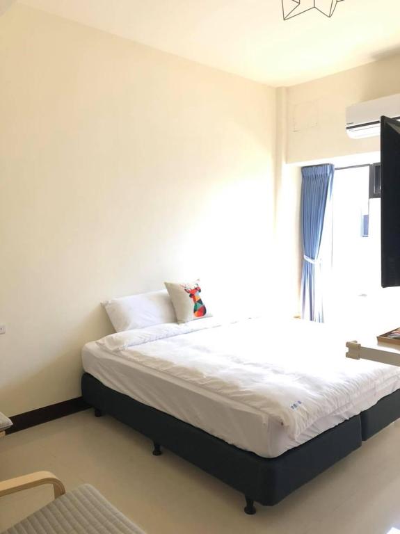 Postel nebo postele na pokoji v ubytování Elk Kitten Homestay