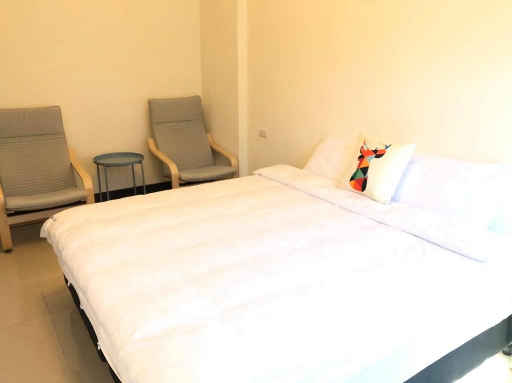Postel nebo postele na pokoji v ubytování Elk Kitten Homestay