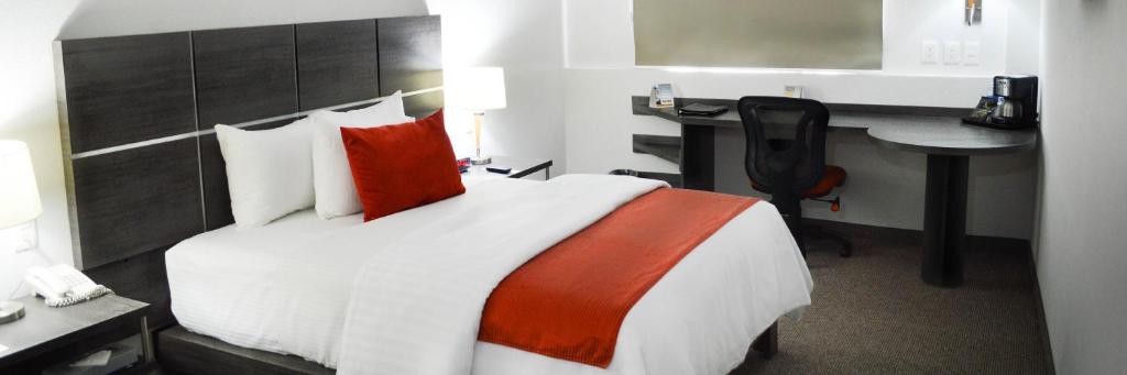 Postel nebo postele na pokoji v ubytování Hotel BeWow Querétaro