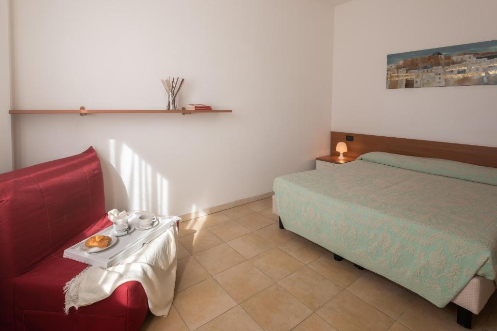 Postel nebo postele na pokoji v ubytování Residence Le Fontane