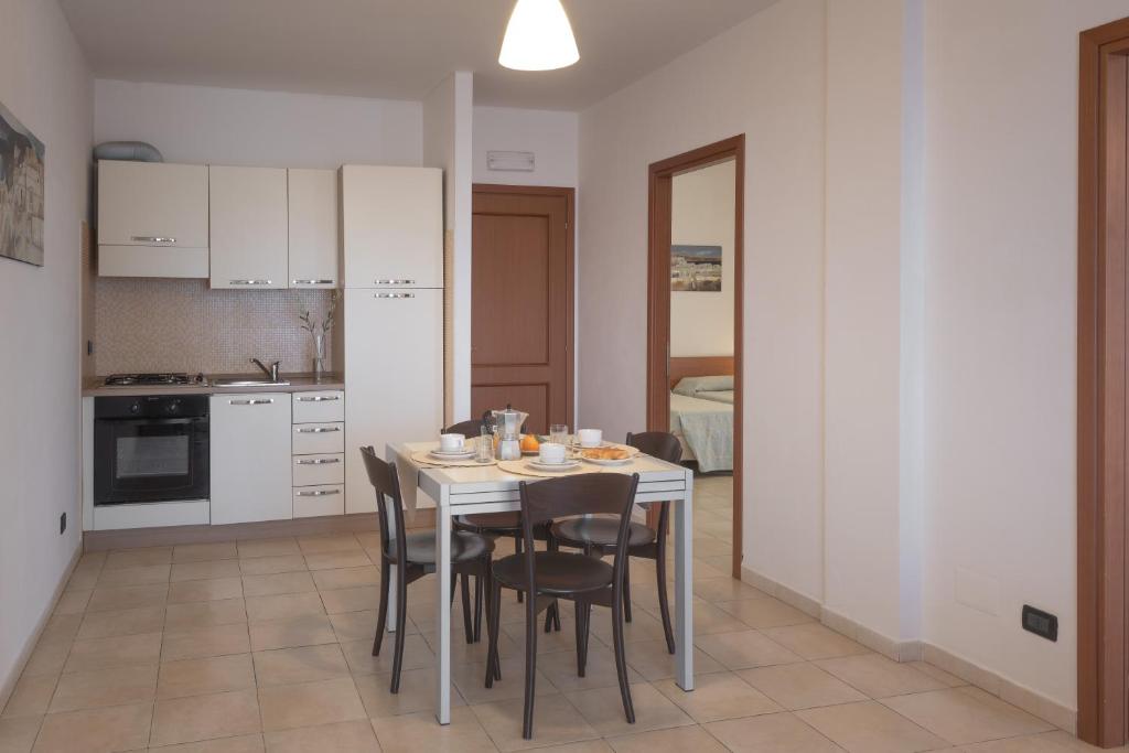 Kuchyň nebo kuchyňský kout v ubytování Residence Le Fontane