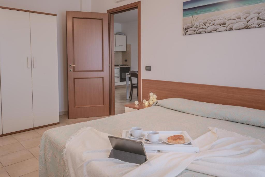 Postel nebo postele na pokoji v ubytování Residence Le Fontane