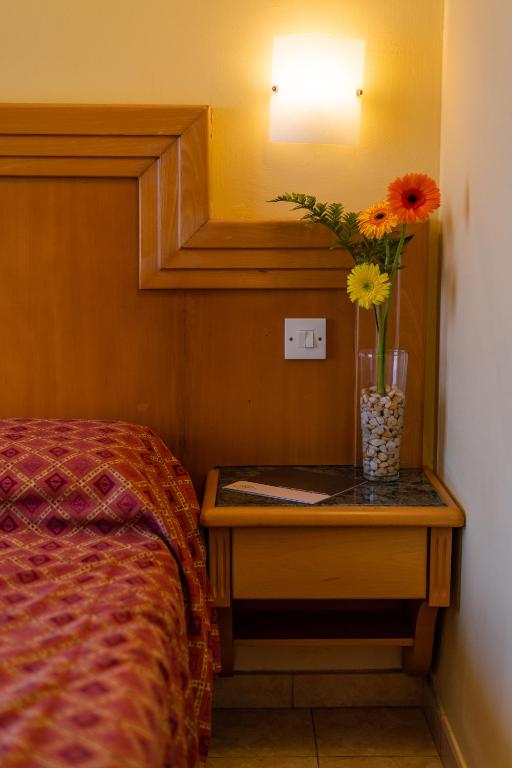 En eller flere senge i et værelse på Hotel San Andrea