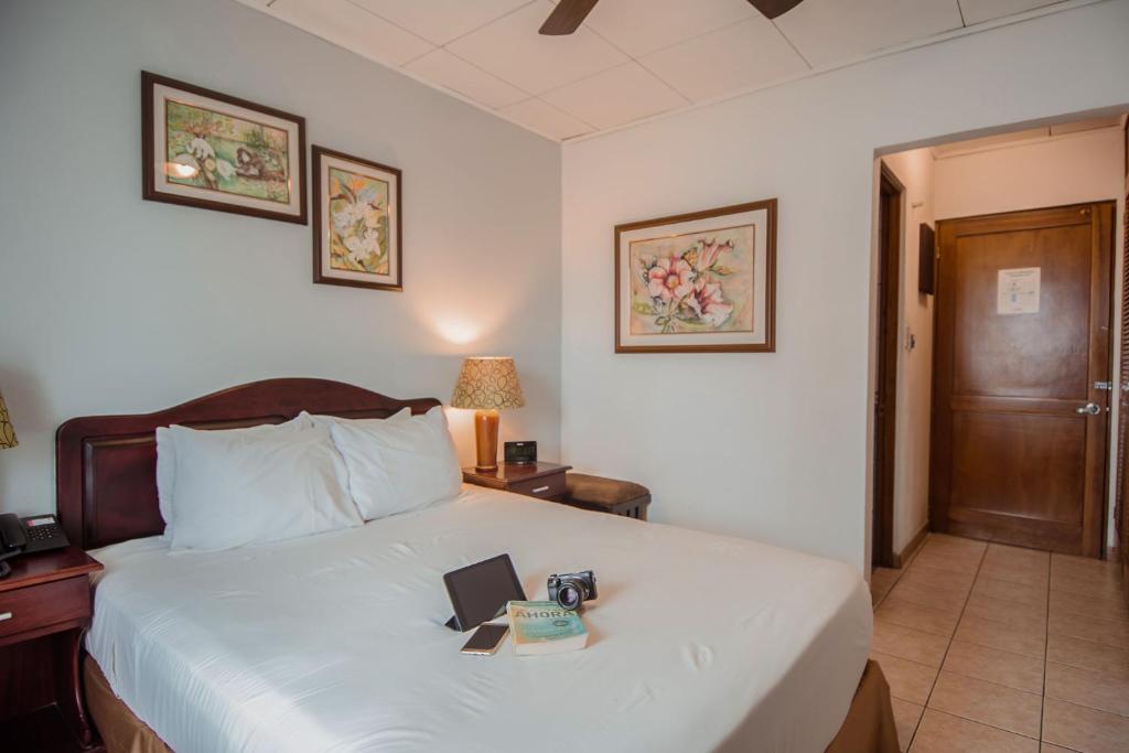 Postel nebo postele na pokoji v ubytování La Sabana Hotel Suites Apartments