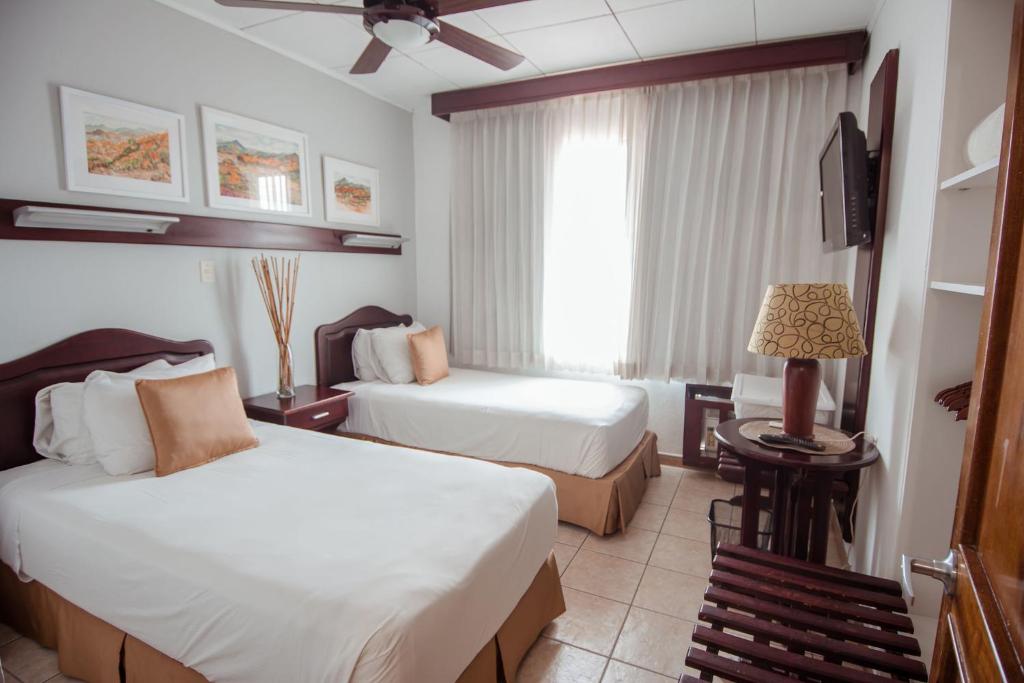 Postel nebo postele na pokoji v ubytování La Sabana Hotel Suites Apartments
