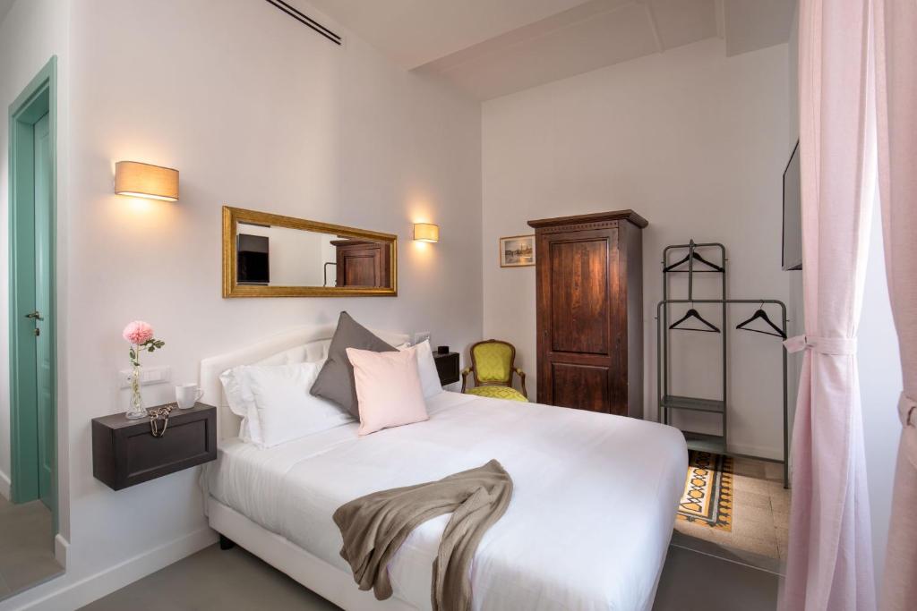 Posteľ alebo postele v izbe v ubytovaní Guesthouse Serafino