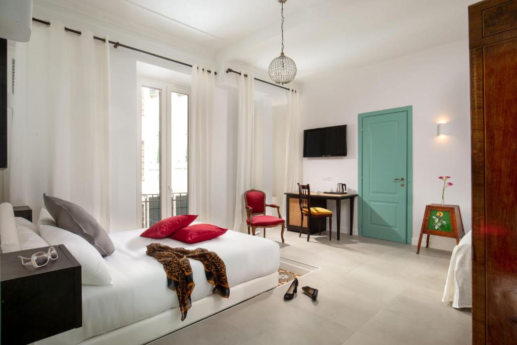 Televízia a/alebo spoločenská miestnosť v ubytovaní Guesthouse Serafino