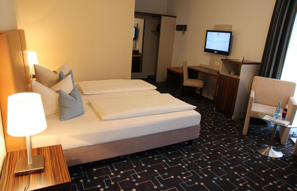 Postel nebo postele na pokoji v ubytování Hotel Königer