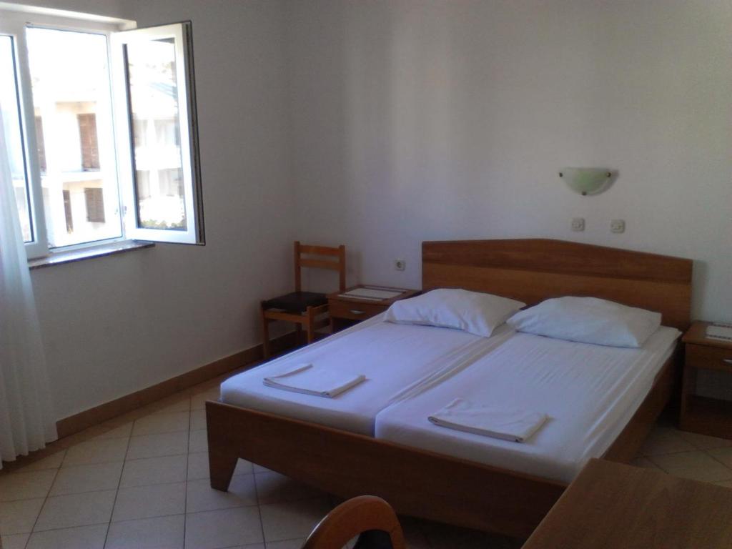 Postel nebo postele na pokoji v ubytování Guest House Frane