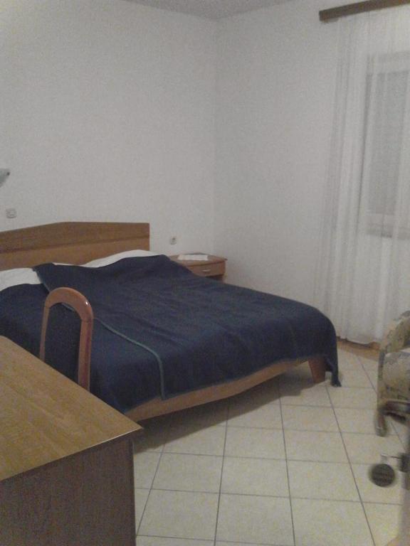 Postel nebo postele na pokoji v ubytování Guest House Frane