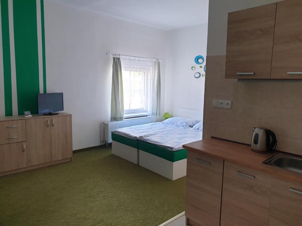 Postel nebo postele na pokoji v ubytování Penzion a hospůdka U Anny