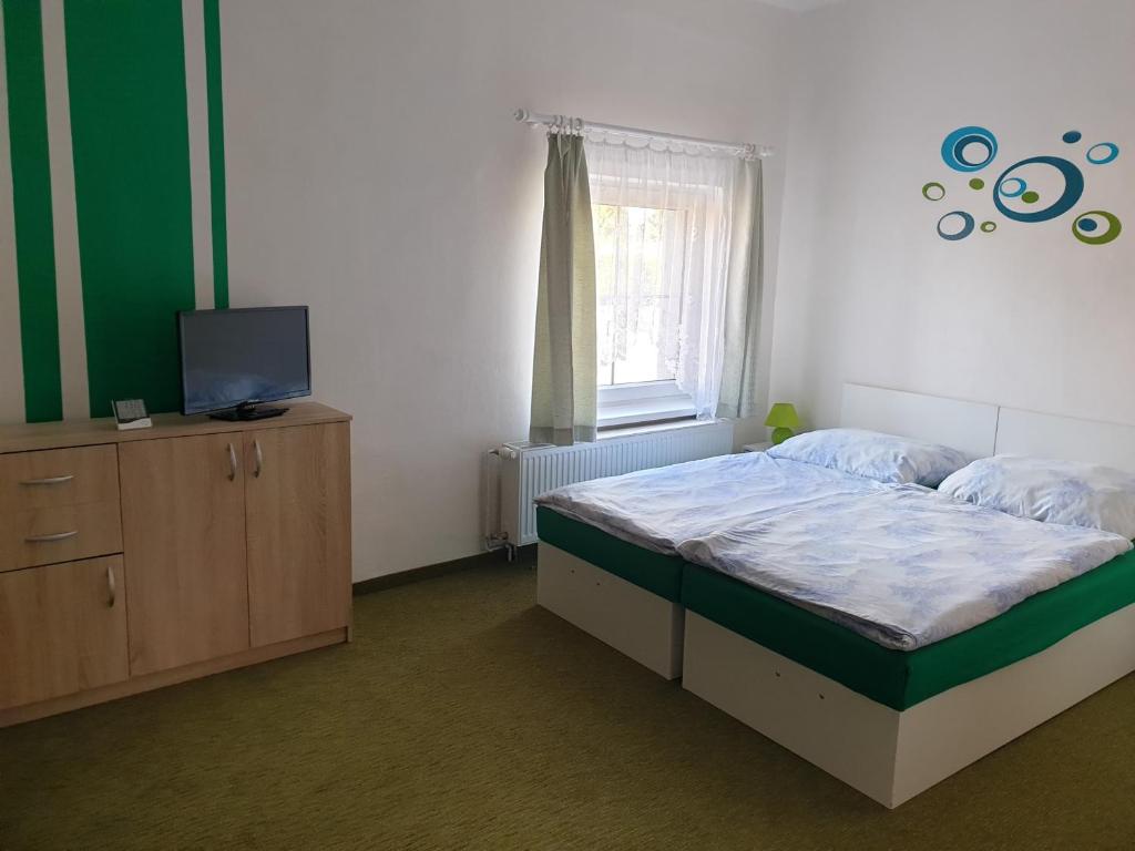 Postel nebo postele na pokoji v ubytování Penzion a hospůdka U Anny