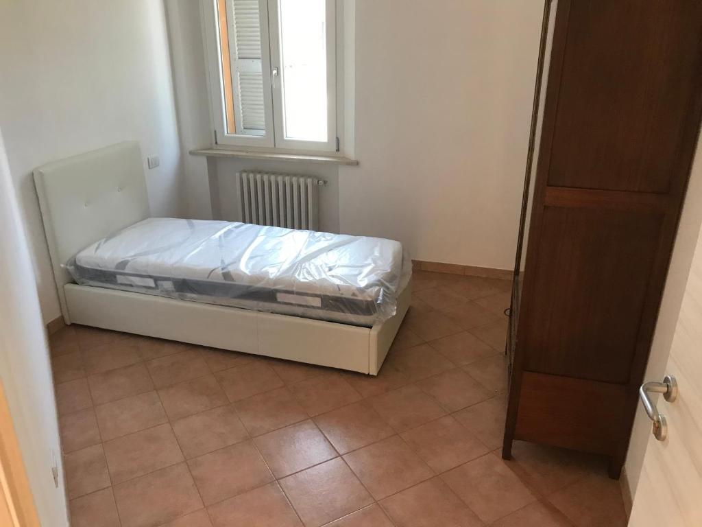 Postel nebo postele na pokoji v ubytování B&B Giulia