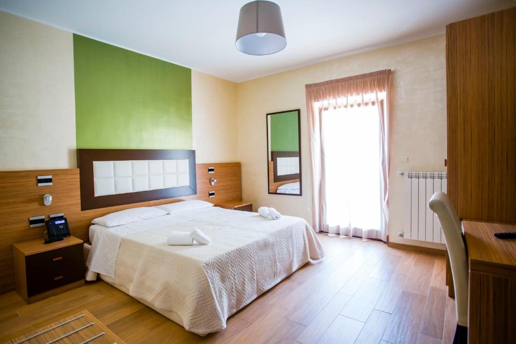 Posteľ alebo postele v izbe v ubytovaní Hotel Monte Campo