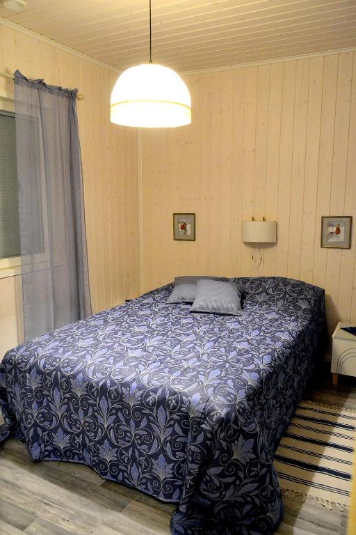 Postel nebo postele na pokoji v ubytování Talo Ylläs