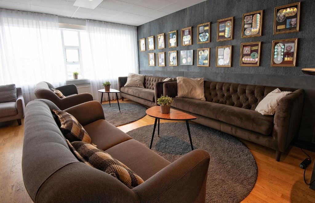 a large living room with couches and a table at B14 Hostel in Reykjavík