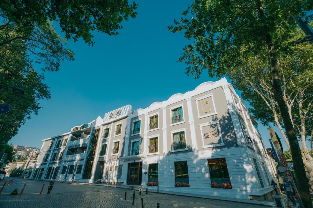 a large white building on a city street at Ener Old Castle Resort Hotel in Gebze