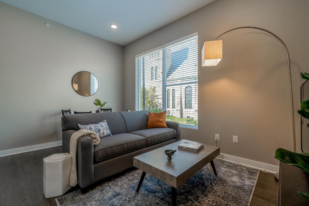 a living room with a couch and a table at Kasa Downtown Des Moines in Des Moines