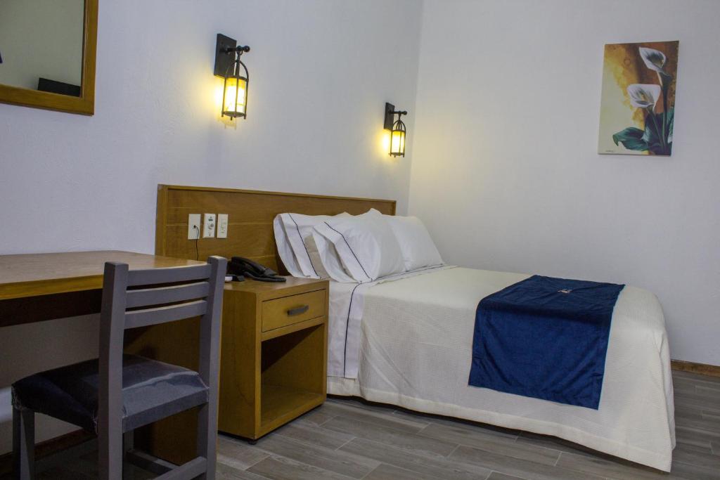 Postel nebo postele na pokoji v ubytování Hotel Real de Castilla Colonial