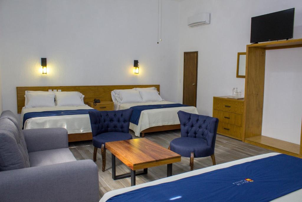 Postel nebo postele na pokoji v ubytování Hotel Real de Castilla Colonial