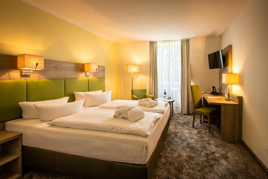 Postel nebo postele na pokoji v ubytování BERG & SPA HOTEL GABELBACH