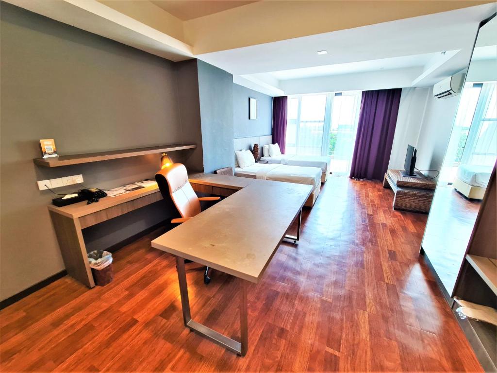 Postel nebo postele na pokoji v ubytování Nexus Business Suite Hotel
