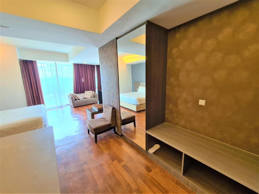 Postel nebo postele na pokoji v ubytování Nexus Business Suite Hotel