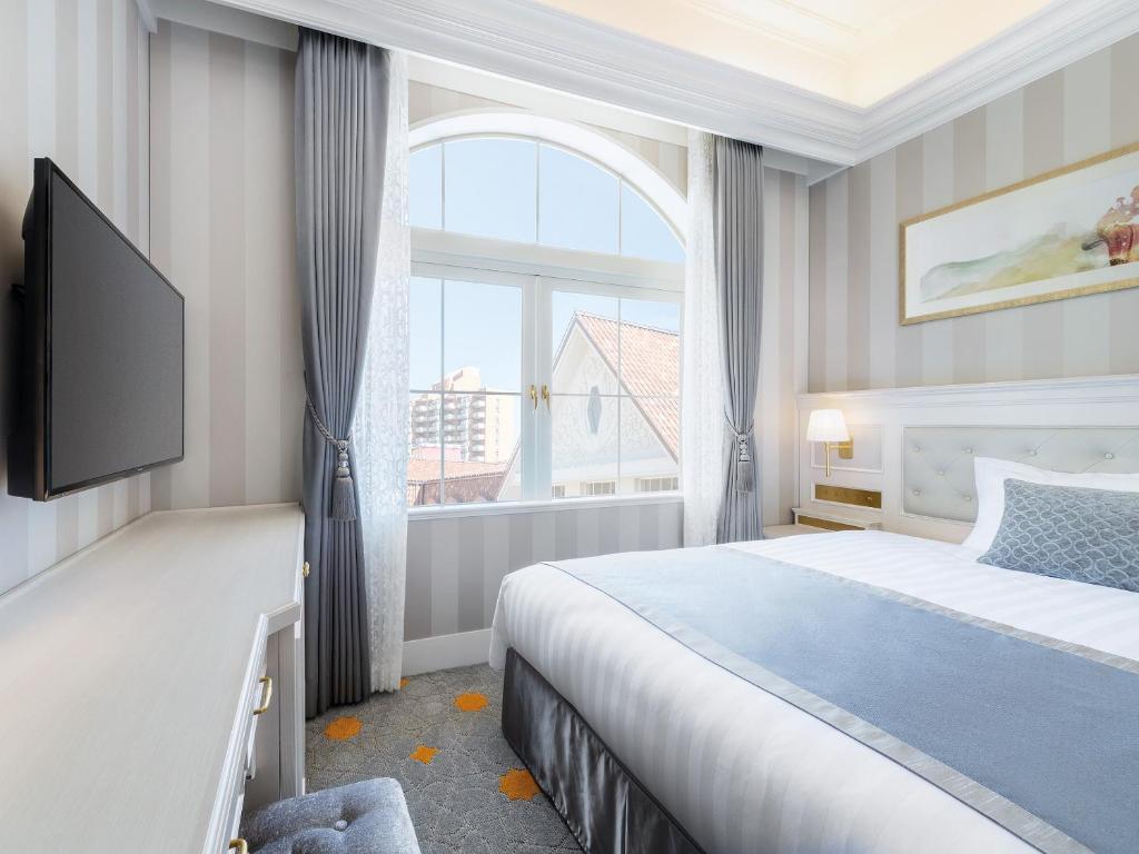 Postel nebo postele na pokoji v ubytování Takarazuka Hotel