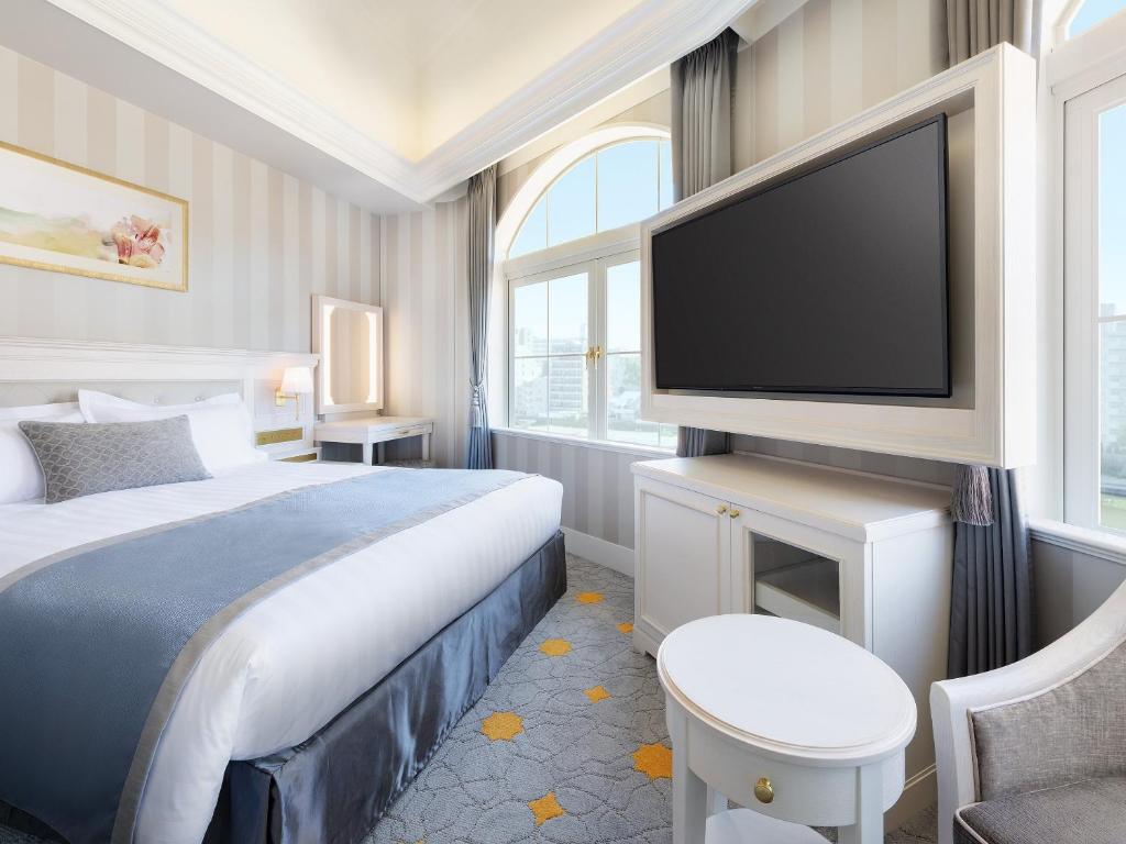 Postel nebo postele na pokoji v ubytování Takarazuka Hotel