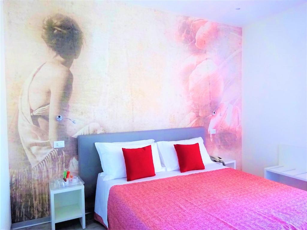 Postel nebo postele na pokoji v ubytování Hotel Lem-Casadei