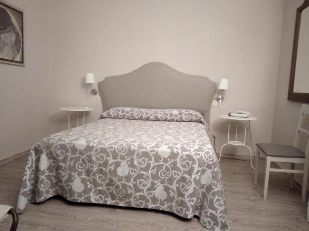 Postel nebo postele na pokoji v ubytování Hotel Stipino