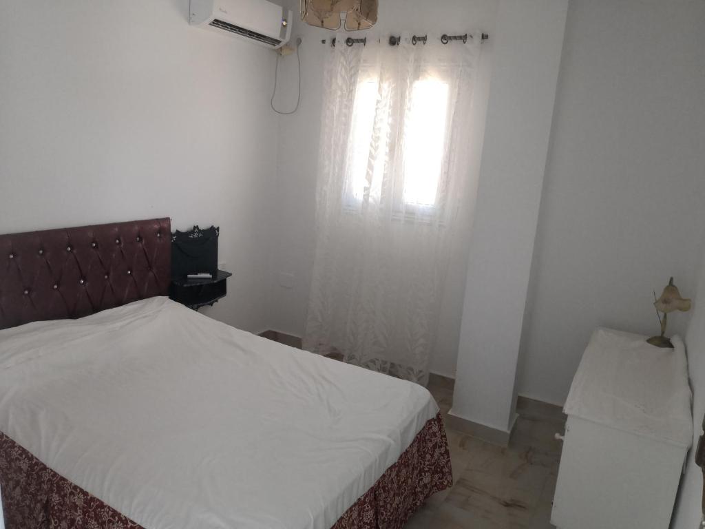 Postel nebo postele na pokoji v ubytování L'Hirondelle de Kelibia : Chez Amou