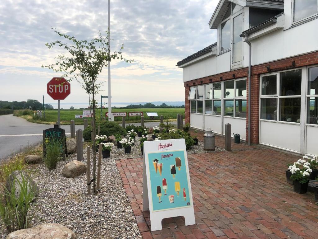 a sign in front of a building with a stop sign at Samsted in Middelfart