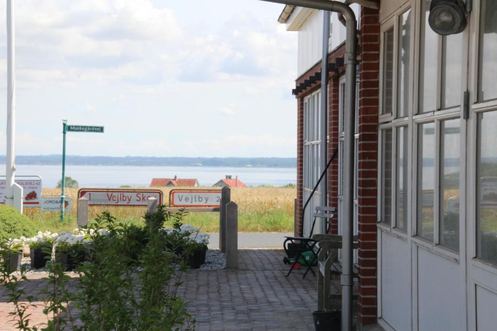 a window of a building with a view of the water at Samsted in Middelfart