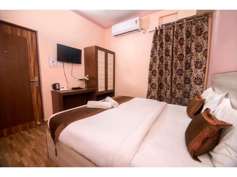 Postel nebo postele na pokoji v ubytování Hotel Bleue Mont