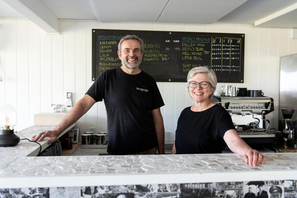 a man and a woman standing in a kitchen at Samsted in Middelfart